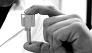 Worker´s hand holding a key